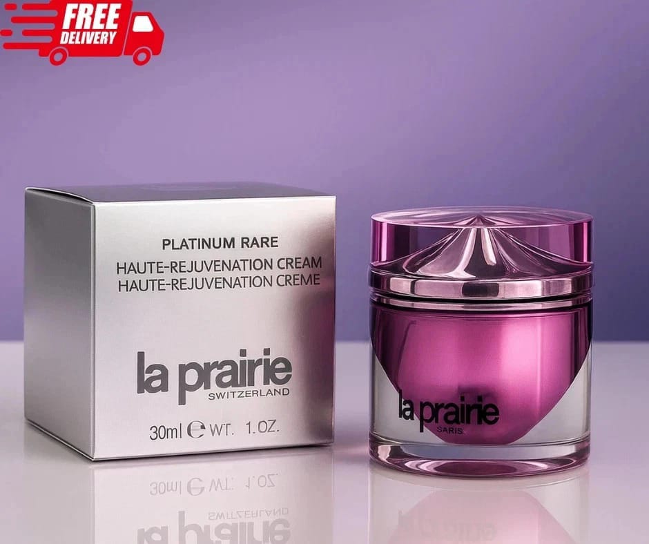 La Prairie Platinum Rare Hauté-Rejuvenation Cream jar and packaging on a reflective surface with a purple background.