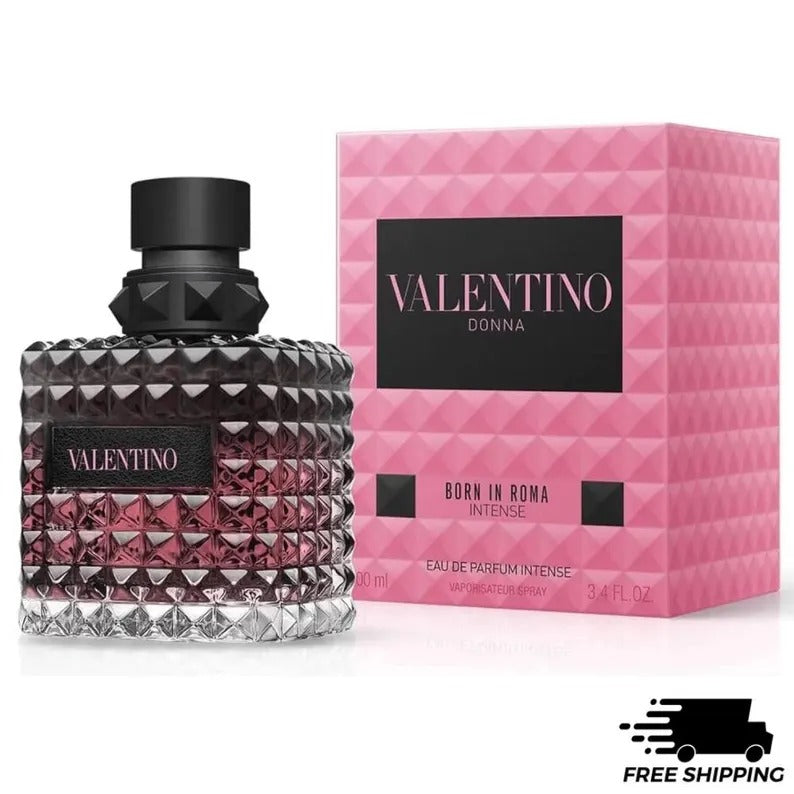 Valentino Donna Born in Roma Intense Eau de Parfum bottle with a faceted dark glass body and pink liquid, shown next to its pink geometric box packaging on a white background.